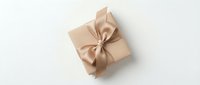 Elegant beige gift box with satin ribbon bow, top view, isolated on white background. Perfect for holiday, birthday, and luxury packaging concepts.