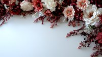 Romantic floral border with white carnations and burgundy dried flowers on white background, creating elegant frame composition for wedding stationery design.