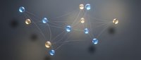 Glowing spheres connected by luminous lines form an abstract network structure, representing data connectivity, digital communication, and interconnected systems for technology and business concepts.