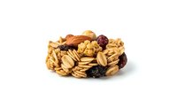 Mixed nuts and dried fruits assortment isolated on white background for healthy snacking, cooking recipes and nutritional food concepts.