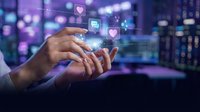 Hands holding digital icons including heart and chat symbols with glowing neon lights and city skyline background for social media and communication concepts.