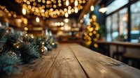 Rustic wooden table in cozy restaurant with festive Christmas decorations, bokeh lights, and pine branches creating warm holiday atmosphere.