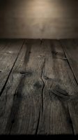 Dark rustic wooden surface with natural grain texture and soft bokeh background, great for product display and food photography.