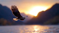 Majestic bald eagle soaring over mountain lake at sunset, wings spread against golden sky, capturing wilderness and freedom in dramatic natural setting.