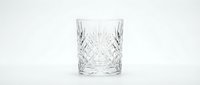 Crystal cut glass tumbler with diamond pattern design isolated on white background for luxury drinkware and elegant dining concepts.