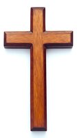 Wooden cross with two-tone finish featuring light oak center and dark mahogany border isolated on white background. Religious symbol for church, prayer and faith.