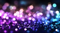 Magical bokeh lights creating dreamy atmosphere with purple and blue glowing circles on dark background, defocused sparkles for festive design.