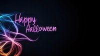 Happy Halloween neon text with colorful glowing light trails on dark background for party invitations and seasonal marketing campaigns.