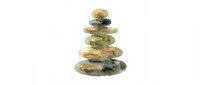 Stacked stones in earthy tones balanced in pyramid formation on white background, symbolizing zen, harmony, meditation, wellness, and mindfulness practices for relaxation and balance.