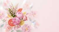 Elegant spring bouquet with pink peonies, lily of the valley and citrus slices on soft pastel background for wedding invitations and romantic designs.