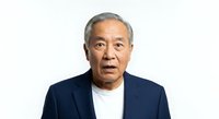 Senior Asian man with gray hair wearing navy blazer and white shirt, isolated on white background for corporate, business, and professional portrait use.