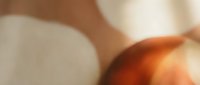 Soft abstract blurred background with warm beige and terracotta tones, smooth bokeh texture for design, wallpaper, or backdrop use.
