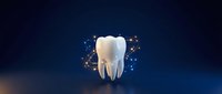 White tooth with glowing particles on dark blue background for dental care, oral health and dentistry concepts.