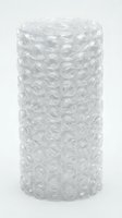 Transparent bubble wrap roll with protective air-filled cushioning for shipping, packaging, and fragile item protection on white background.