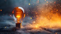 Glowing light bulb on dark background with magical sparkles and bokeh effects, concept of creativity and innovation perfect for business presentations and inspiration designs.