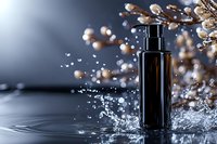 Black cosmetic bottle with water splash and delicate floral branches against dark background, dramatic lighting creates luxury skincare product presentation.