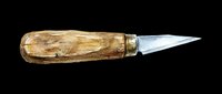 Vintage letter opener with wooden handle and metal blade, isolated on transparent background, ready for clipart, print-on-demand, and design projects.