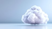 Fluffy white cloud floating against soft blue background, minimalist composition with gentle shadows creates dreamy atmosphere for technology and cloud computing concepts.