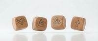 Wooden dice with engraved wellness icons including diamond, meditation stones, lotus flower and arrow symbols on white background for mindful living concepts.