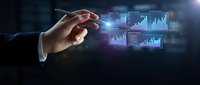 Businessman hand pointing at digital financial charts and graphs displaying market data analytics and growth statistics on dark background.