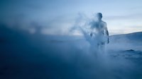 Male figure standing in misty geothermal hot spring waters, surrounded by steam and mineral-rich vapors, creating ethereal atmosphere for wellness and spa concepts.