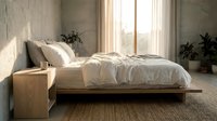 Serene minimalist bedroom with natural light streaming through floor-to-ceiling windows, featuring a low wooden platform bed with white linens, potted plants, and neutral tones for interior design and home decor projects.