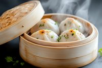 Steaming hot Asian dumplings in traditional bamboo steamer with fresh herbs and spices, served on dark background with rising steam and soft lighting.