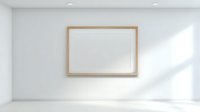 Empty wooden frame hanging on white wall in minimalist room with natural sunlight shadows creating clean modern interior space for artwork display.