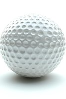 White golf ball with distinctive dimpled pattern isolated on white background, showing detailed surface texture and subtle shadows for sports and recreation designs.