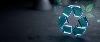 Glowing recycling symbol with green leaves on dark surface representing environmental sustainability and eco-friendly waste management solutions.