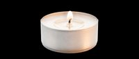 Lit tea light candle in white container isolated on transparent background, ready for design use on t-shirts, stickers, print-on-demand products, and digital crafts.