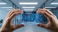 Hands holding digital holographic interface with data analytics dashboard in modern office environment for technology and business solutions.