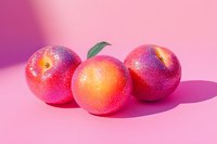 Fresh peaches covered in sparkly glitter on pink background with dramatic shadows, creative food photography for modern design and advertising projects.