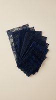 Navy blue lace fabric samples with intricate floral patterns and delicate textures arranged in fan formation on neutral background for fashion design projects.