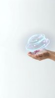 Hand holding glowing holographic planet with neon rings and orbital paths, representing technology, innovation, and digital future concepts for web and marketing use.