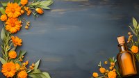 Orange calendula flowers and essential oil bottle arranged on dark wooden background, forming decorative border frame for wellness and aromatherapy design.