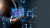 Businessman in dark suit holding glowing digital interface with network icons and circuit patterns, representing data management, cybersecurity, and technology solutions for business.
