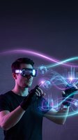 Young Caucasian man wearing VR headset interacting with holographic data visualization and futuristic digital interface elements in virtual reality.
