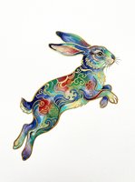 Colorful decorative rabbit leaping with intricate ornamental patterns in vibrant blues, greens, and golds. Isolated on transparent background, ready for t-shirts, stickers, clipart, and print-on-demand designs.
