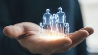 Protective hands holding glowing family silhouettes representing life insurance, healthcare coverage, and financial security for loved ones.