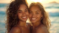 Two young women with radiant smiles enjoying sunset at tropical beach, perfect for lifestyle, beauty, and wellness advertising campaigns, natural beauty concept.