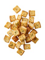 Crispy seasoned croutons isolated on white background, ready for salad toppings, soups, and culinary design projects.