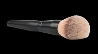 Makeup brush with black handle and soft natural bristles, isolated on transparent background, ready for beauty product design, t-shirt graphics, clipart, stickers, and print-on-demand applications.