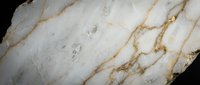 Elegant white marble surface with golden veins and natural stone texture for luxury interior design and architectural backgrounds.