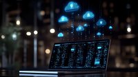 Glowing cloud computing icons float above laptop displaying data analytics dashboard in dark office setting with bokeh lights. Concept for cloud technology.
