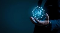 Businessman in dark suit holding glowing digital sphere with bar chart and network connections, representing data analytics, financial growth, and business intelligence technology solutions.