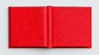Open blank red hardcover book with empty pages lying flat on white background, isolated and ready for design mockups and creative projects.