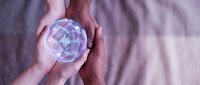 Hands holding crystal ball with geometric patterns inside, fortune telling mystical divination spiritual guidance meditation wellness holistic healing energy.