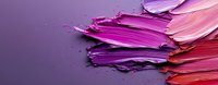 Vibrant smears of purple and pink oil paint texture with brush strokes on dark background, artistic cosmetic palette showing gradient color transition.