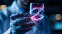 Scientist in protective gloves holding glass beaker with glowing pink and blue particles in dark laboratory setting, demonstrating advanced research experiment.
